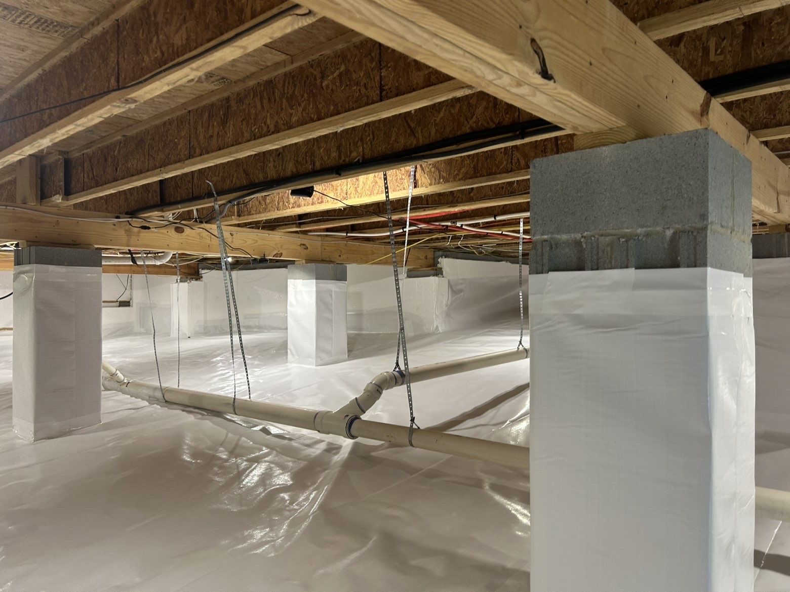 Multiple sealed support columns with white vapor barrier encapsulation system installed